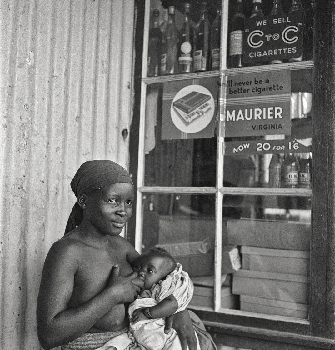 Woman breastfeeding baby, Natal, South Africa