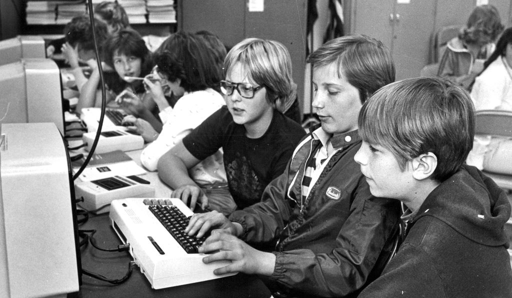 Young boys programming on a computer in 1982.