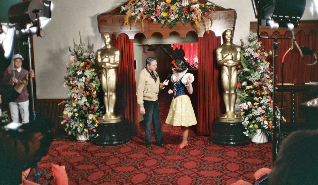 Hollywood columnist Army Archerd interviews Eileen Bowman as Snow White during a rehearsal for the Academy Awards in 1989.

