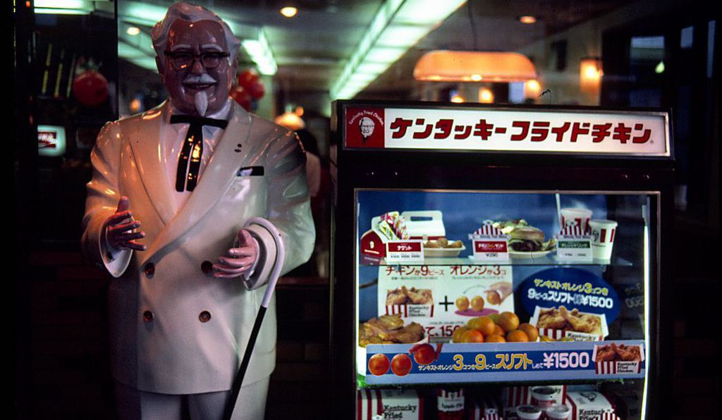A Kentucky Fried Chicken stall with an effigy of Colonel Sanders the founder of the company. 