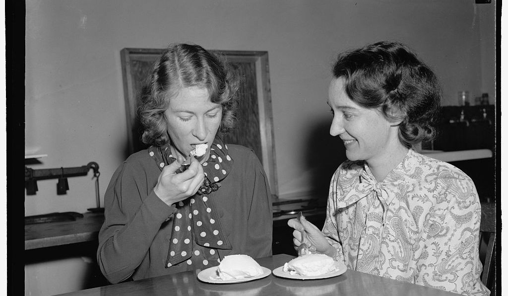 Two USDA employees try ice cream made from salt-preserved cream, 1939.