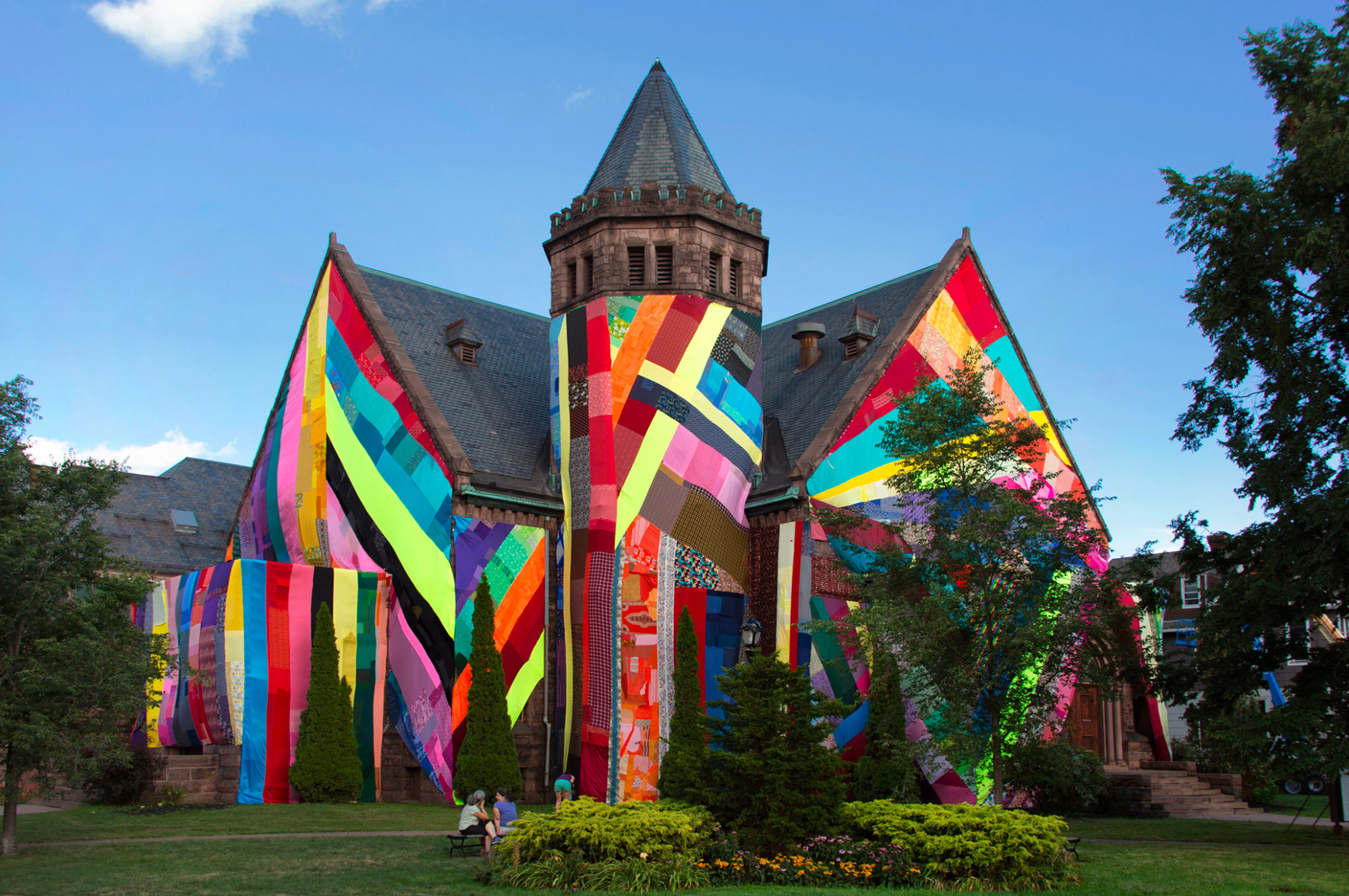 Enormous Panels of Patchworked Fabric Give Colorful Temporary Makeovers to Public Buildings