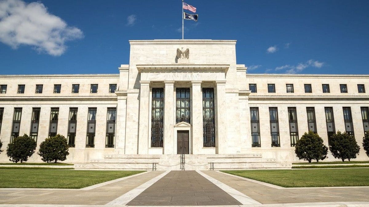 Fed vows to continue bond-buying stimulus until